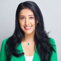 Neelu Kaur, Author, Speaker, Exec Coach, & Wellness Stress Mgt Expert, Sattvic Living LLC posing for a phot with a bright smile on her face